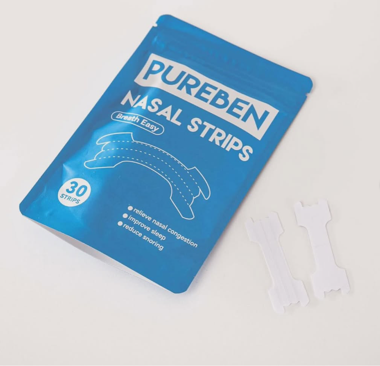 Blue package of Pureben nasal strips on a white background